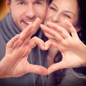 Valentine Couple Making Shape of Heart by their Hands